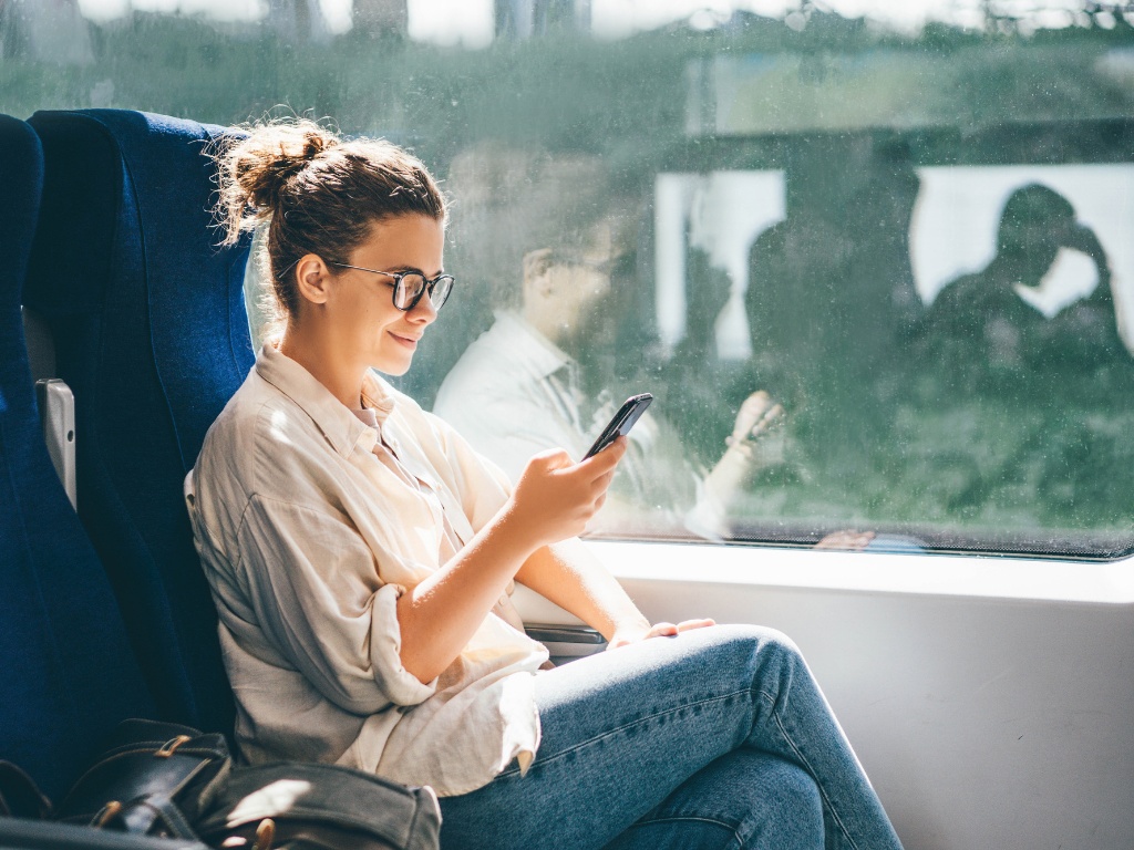 girl messaging in train