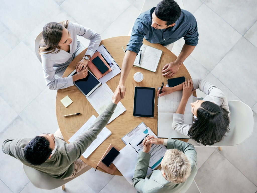five-people-round-table-teamwork